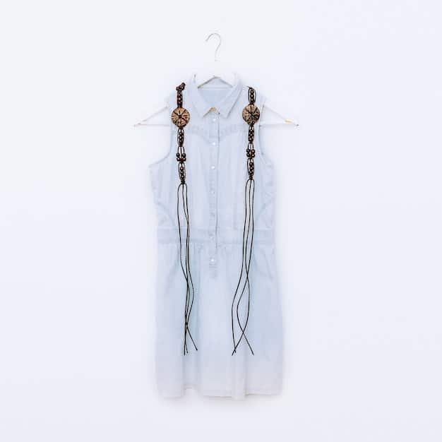 A Shein outfit showcased on a mannequin, comprising a white button-down shirt tucked into high-waisted trousers, paired with heeled loafers and a structured handbag. The focus is on the crispness of the shirt and the tailored fit of the trousers, highlighting the power casual aesthetic.