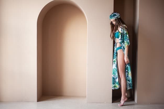 A close-up of various Shein swimsuit cover-ups, including a crochet dress, a floral kimono, and a striped shirt dress. The cover-ups are displayed on a rack in a well-lit room.