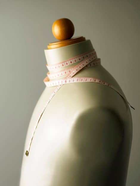 A close-up image showcasing a measuring tape around a mannequin's bust, clearly illustrating how to measure correctly.