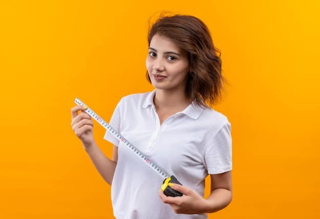 A woman accurately measuring her waist with a measuring tape, with a Shein size chart visible in the background, demonstrating the process of comparing measurements with the chart.