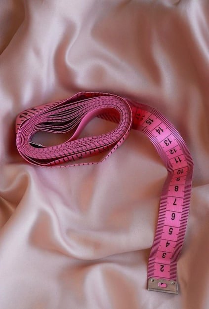 A close-up of a Shein pant size tag showing the measurements for inseam and rise, accompanied by a measuring tape.