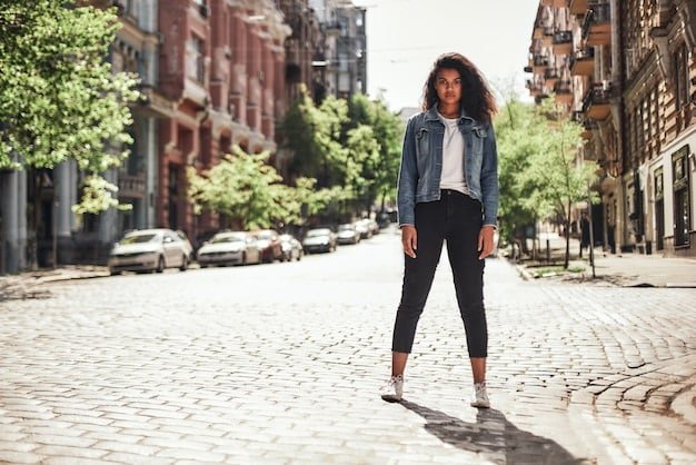 A woman walking on a city street, wearing a Shein athleisure set paired with a stylish denim jacket and fashionable sneakers, showcasing how to transition a gym look into a chic street-style outfit.