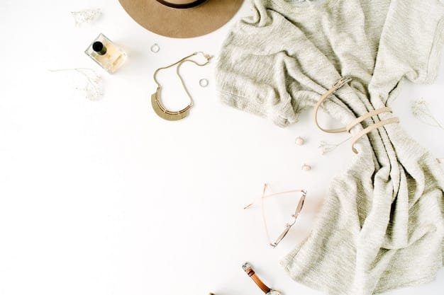 A flat lay of several Shein clothing items on a well-lit surface, including a white t-shirt, black trousers, a denim jacket, and a neutral scarf, showcasing the versatility of the capsule wardrobe pieces.