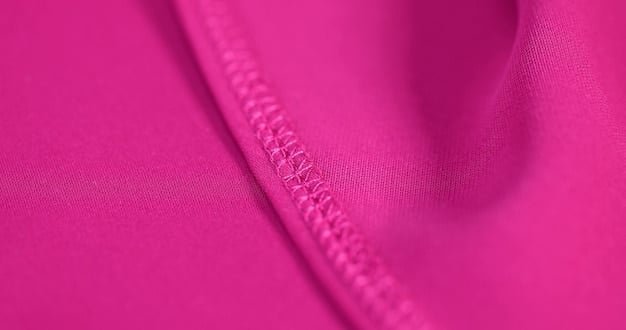 A close-up shot of different Shein activewear fabrics, showcasing various textures and colors. Some fabrics are stretchy and smooth, while others appear thin and slightly see-through.
