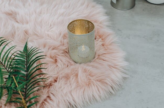 A close-up shot of various Shein home decor items, including geometric throw pillows, a faux fur rug, and metallic candle holders, showcasing the textures and patterns available.